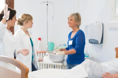 Medical staff with a patient in hospital.