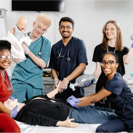 Medical team performing mannequin resuscitation.